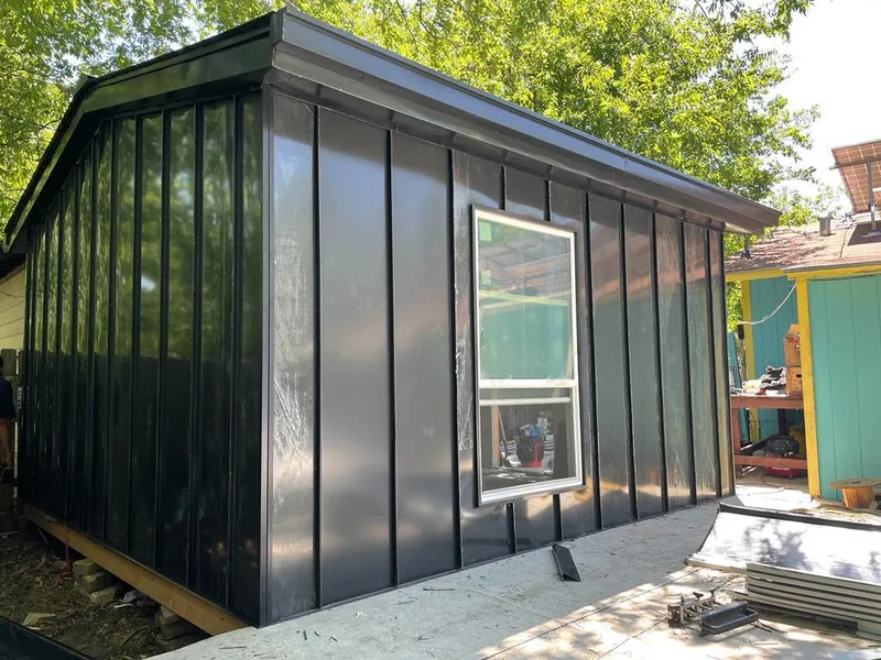 Black standing seam metal wall panels for Roof Inspection in Brock Hall