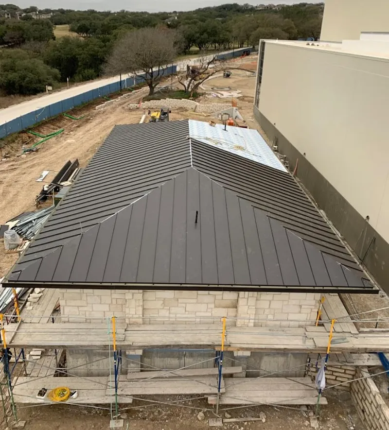 Metal roof new construction with scaffolding in Brock Hall